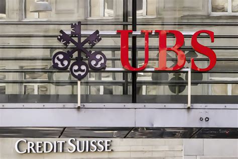 UBS buys rival Credit Suisse to ease turmoil